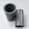Socket 1 inch TS Pralon warna abu-abu dengan lubang terbuka dan tutup terpasang, fitting pipa PVC untuk instalasi plumbing di Pontianak