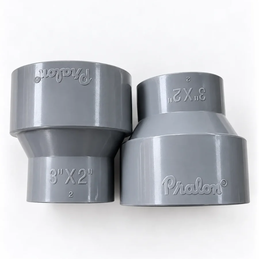 Dua buah socket PVC Pralon 3 x 2 Inch DV berwarna abu dengan tulisan timbul Pralon dan 3"X2" pada badannya.